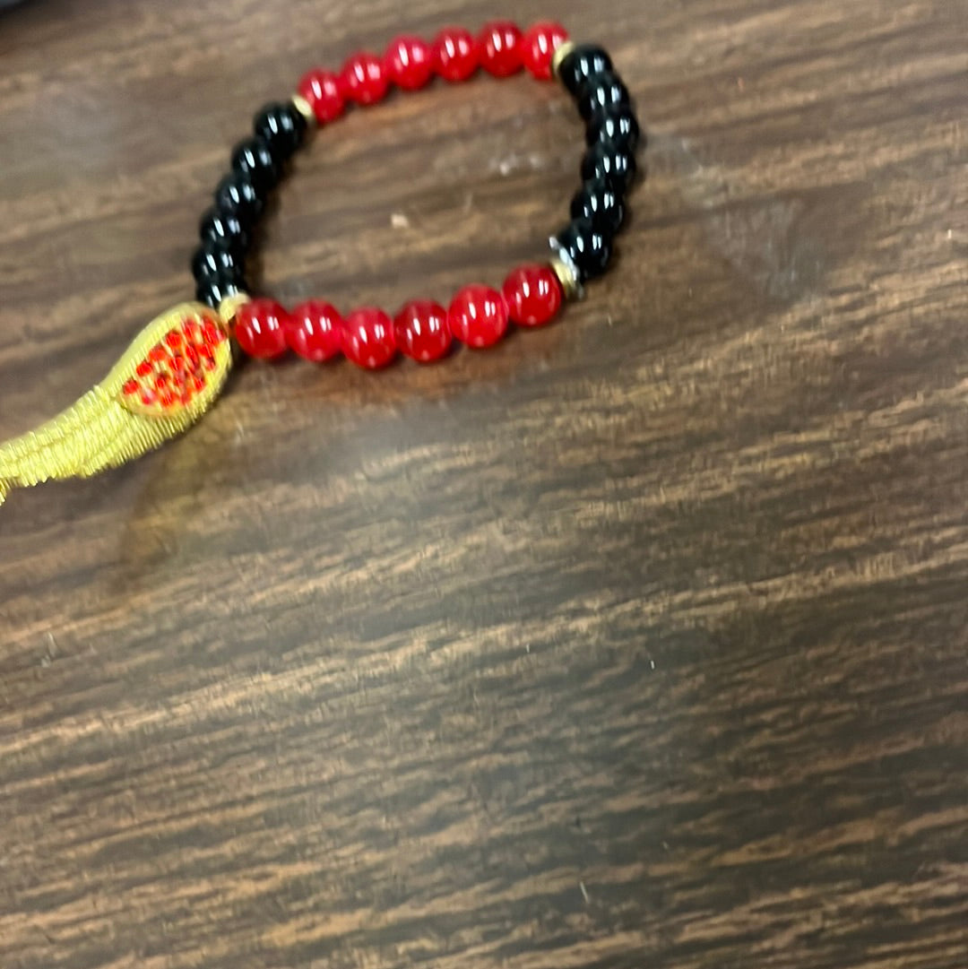 Red and black with wing charm