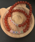 Gemstone bracelet with the word faith