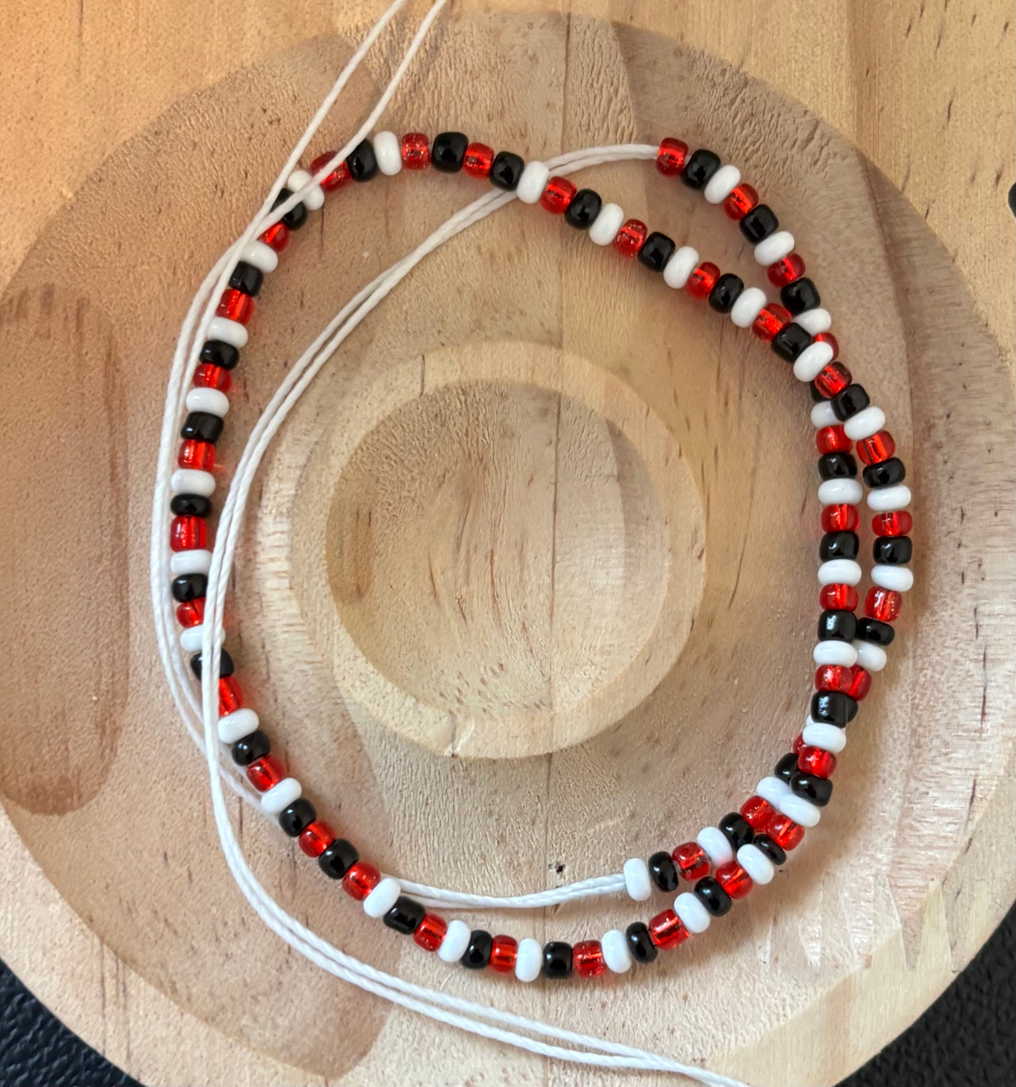 Red black and white tie on anklet 10 in half inches