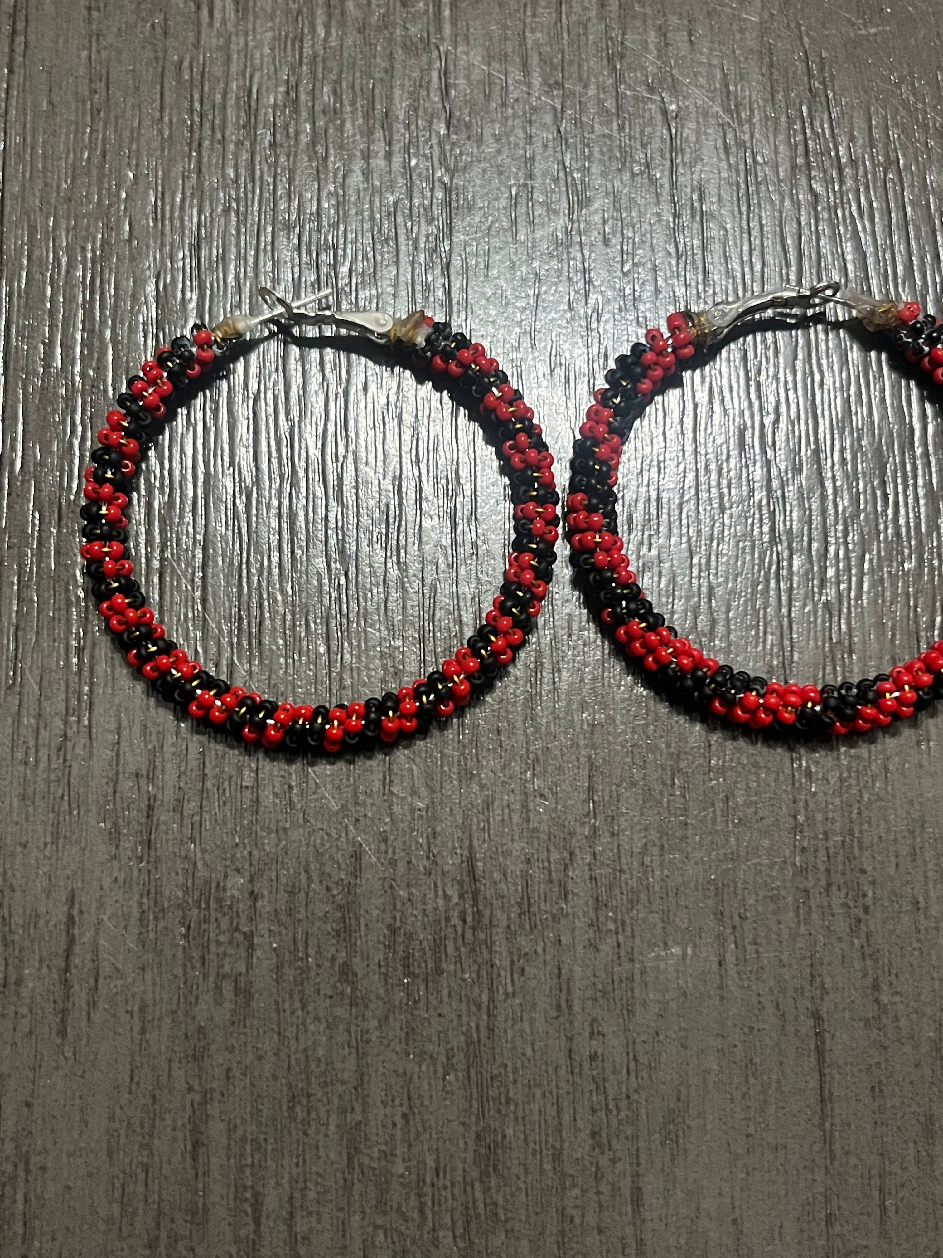 Large red and black hoop earrings