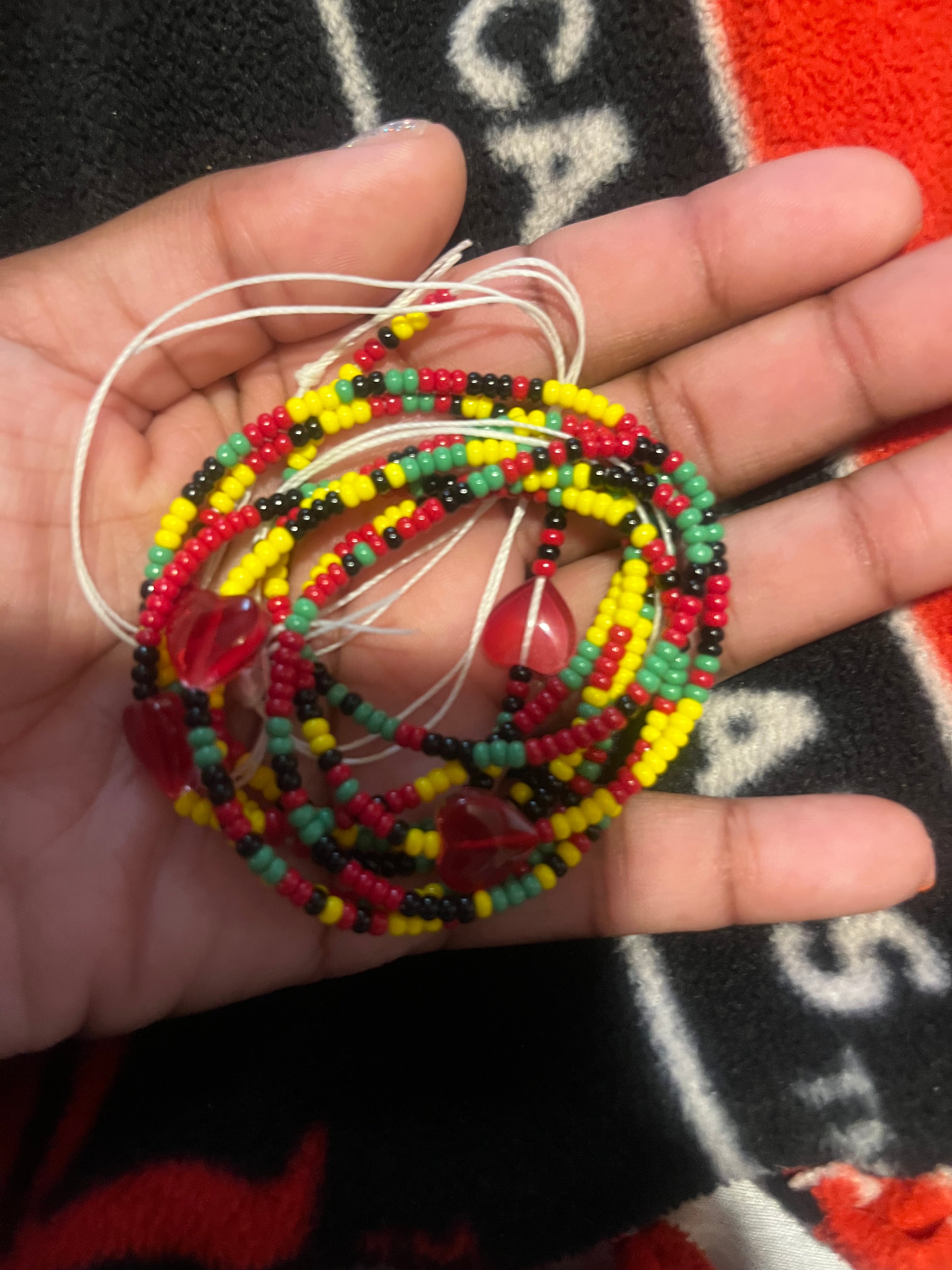 50 inch Juneteenth waist bead with small seed beads tie on with red hearts